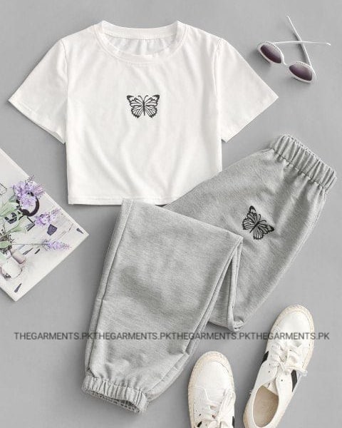BLACK BUTTERFLY POCKET SIZE IN CENTRE WHITE CROP TSHIRT WITH GREY TROUSER BLACK BUTTERFLY POCKET