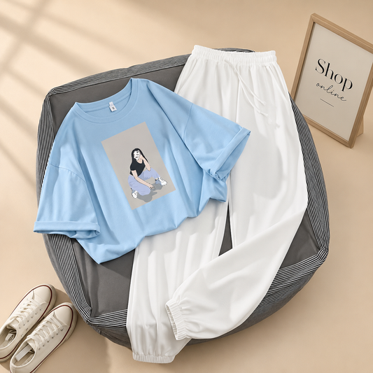 SITTING CAMERA  GIRL SKY BLUE TSHIRT WITH WHITE TROUSER